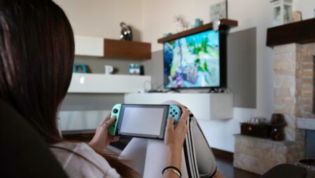 Young girl playing Ninetendo Switch